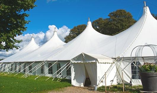 a line of sleek and modern portable restrooms ready for use at an upscale corporate event in Wakefield, MA